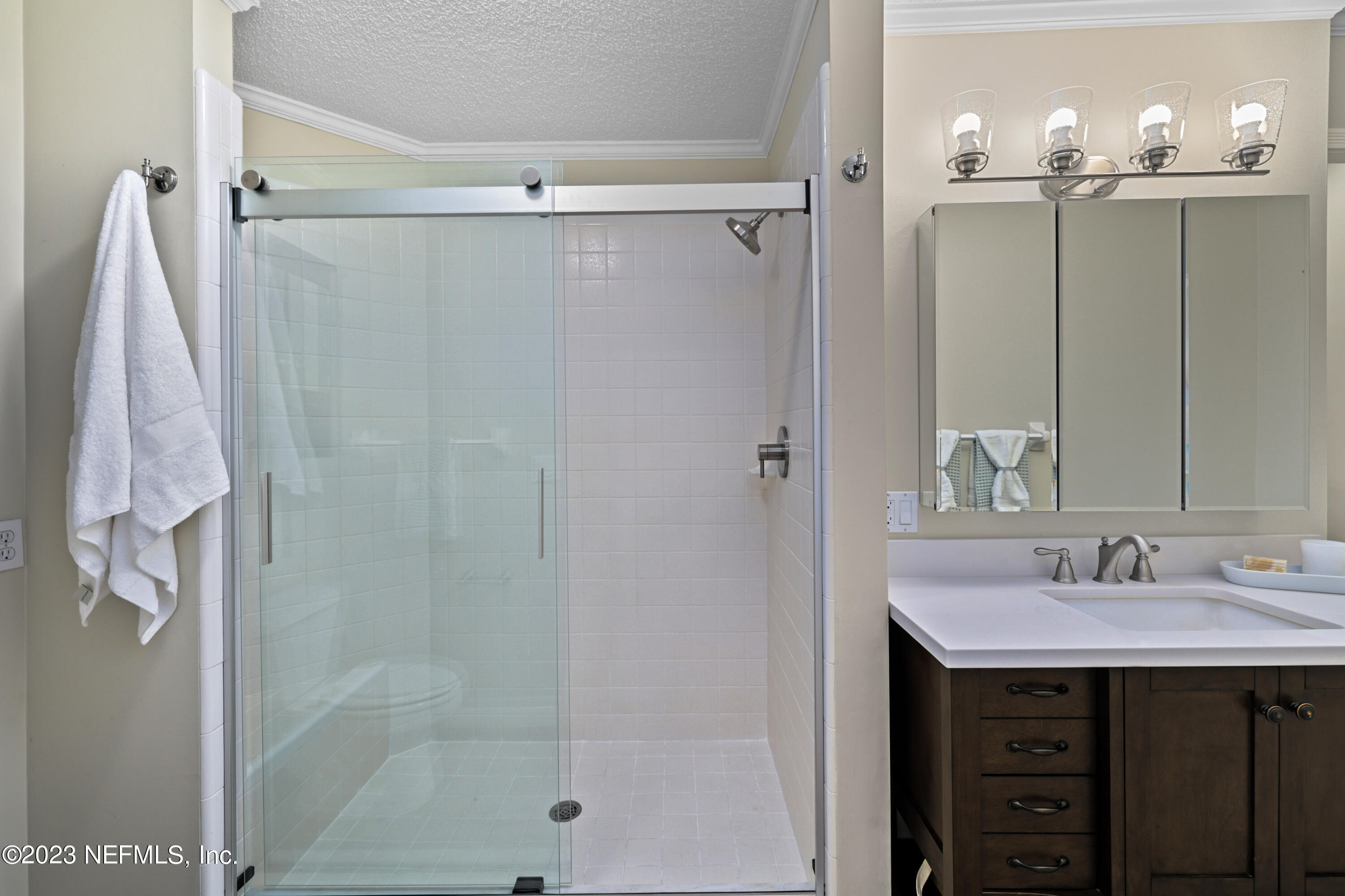 716 Cedar Creek Road Palatka, FL 32177 - Photo 39 of 62 a bathroom with a shower sink vanity and mirror