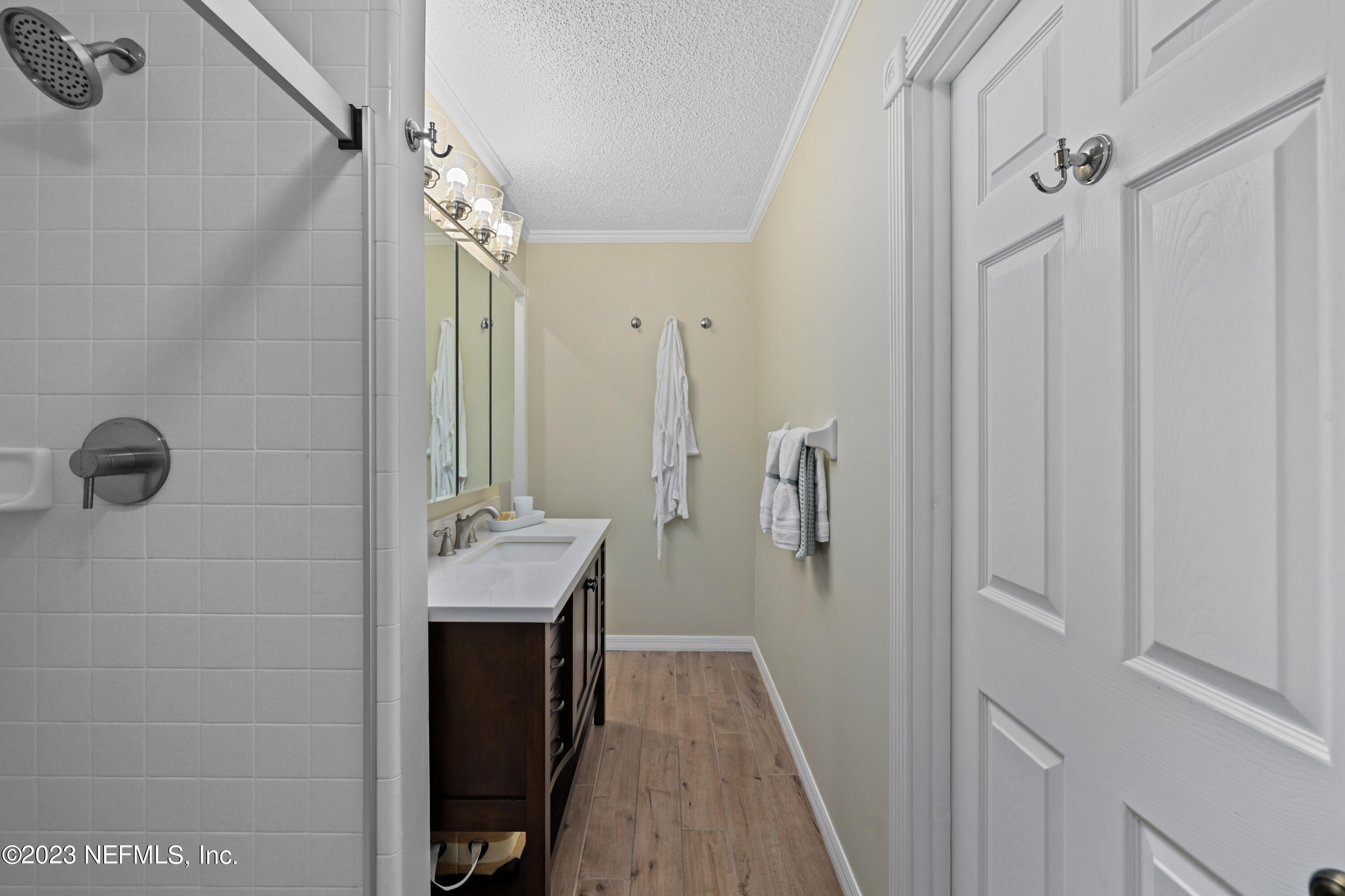 716 Cedar Creek Road Palatka, FL 32177 - Photo 40 of 62 a bathroom with a sink a mirror and shower