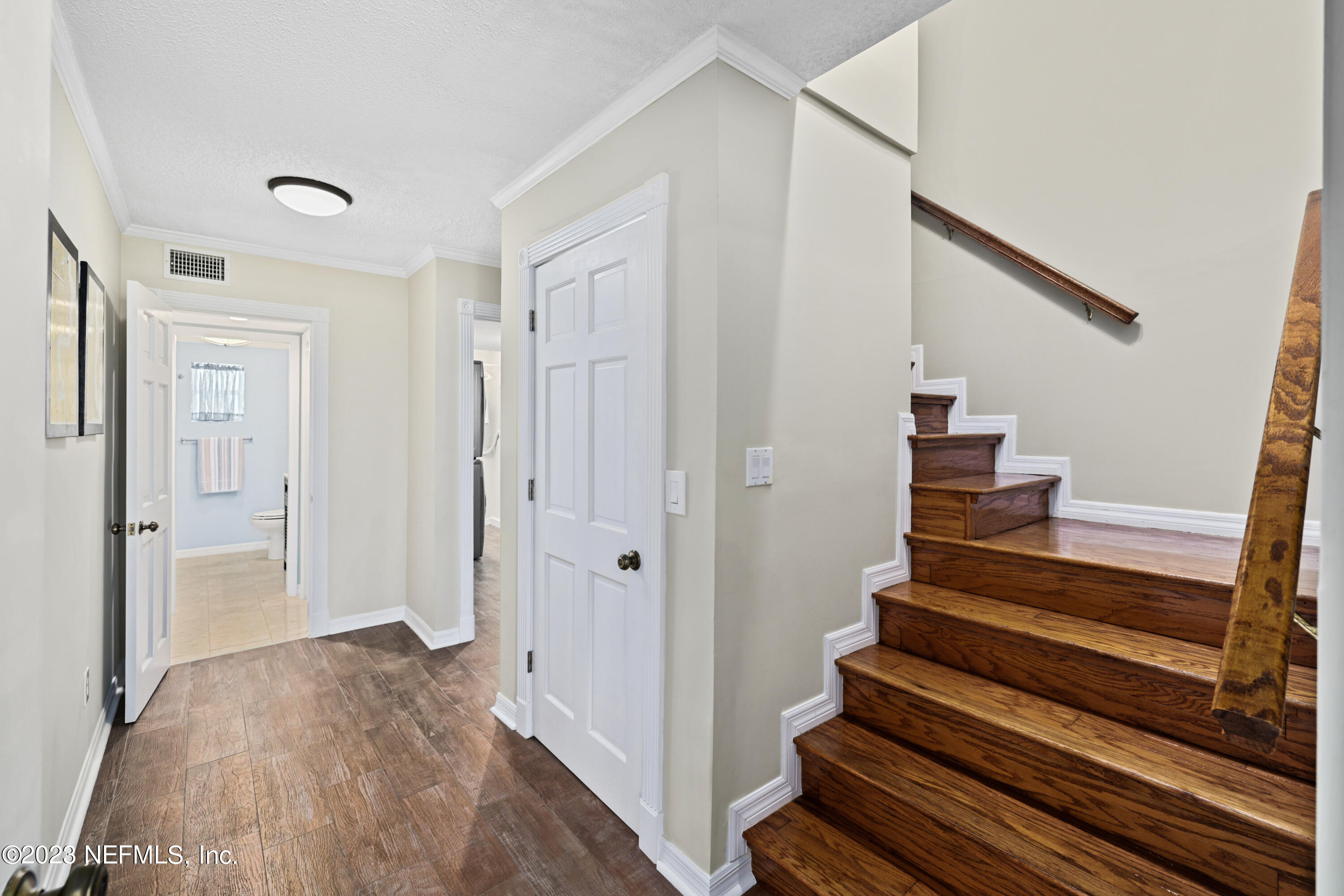 716 Cedar Creek Road Palatka, FL 32177 - Photo 42 of 62 a view of entryway with wooden floor and stairs