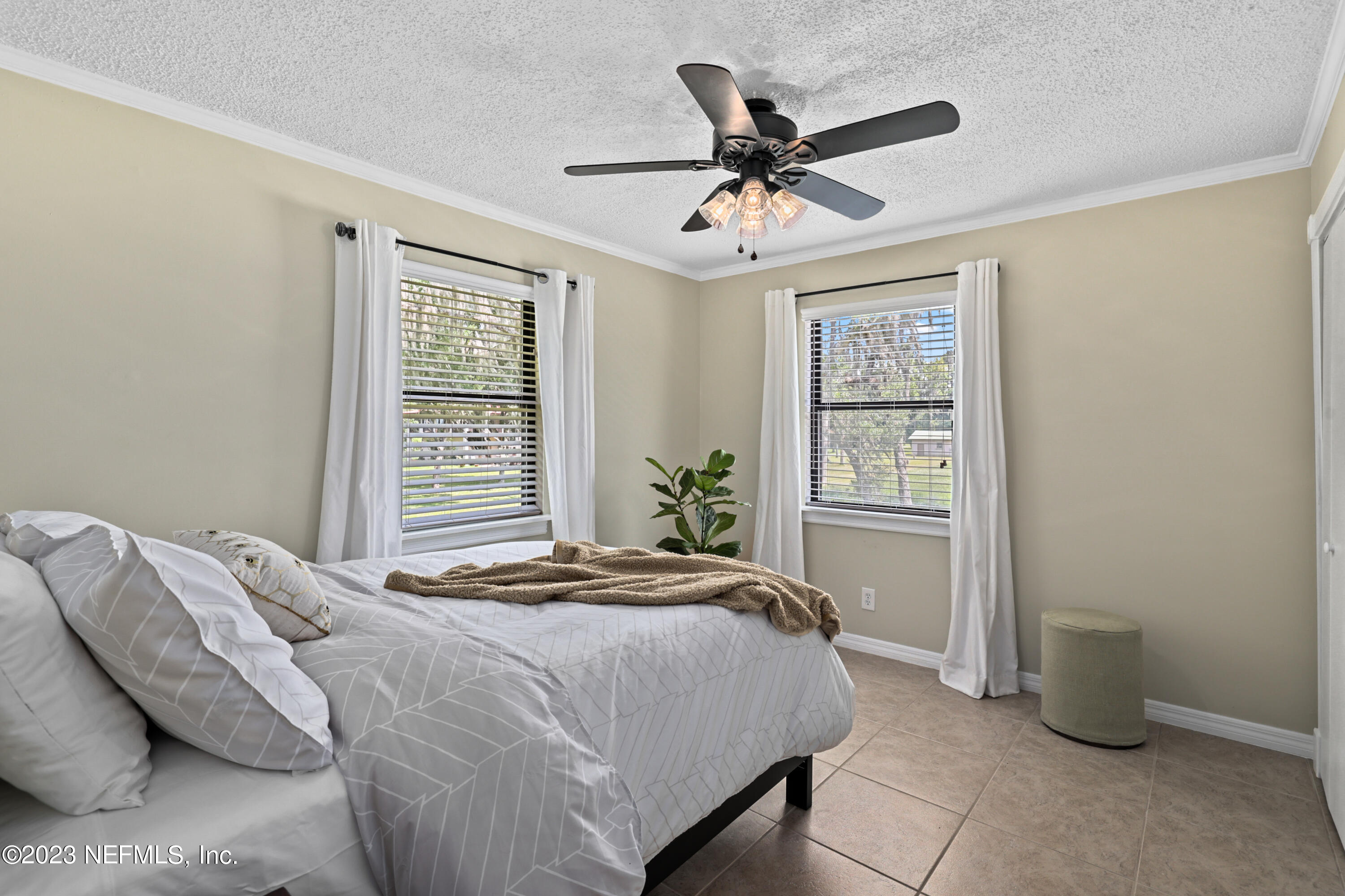 716 Cedar Creek Road Palatka, FL 32177 - Photo 47 of 62 a bedroom with a bed and a window