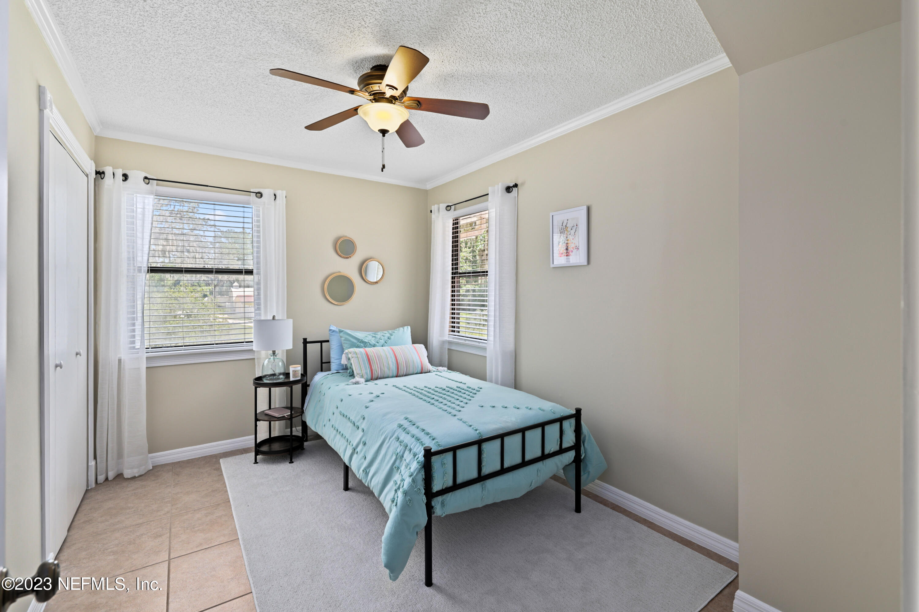 716 Cedar Creek Road Palatka, FL 32177 - Photo 49 of 62 a bedroom with a bed and a table in it