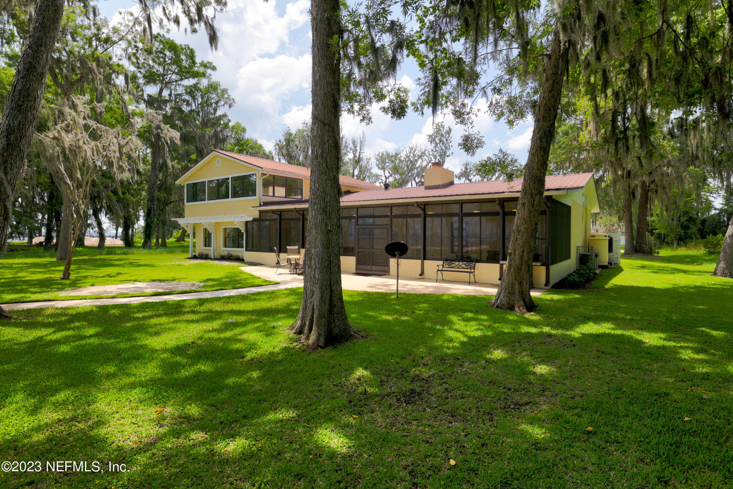 716 Cedar Creek Road Palatka, FL 32177 - Photo 51 of 62 a view of a house with a yard porch and sitting area