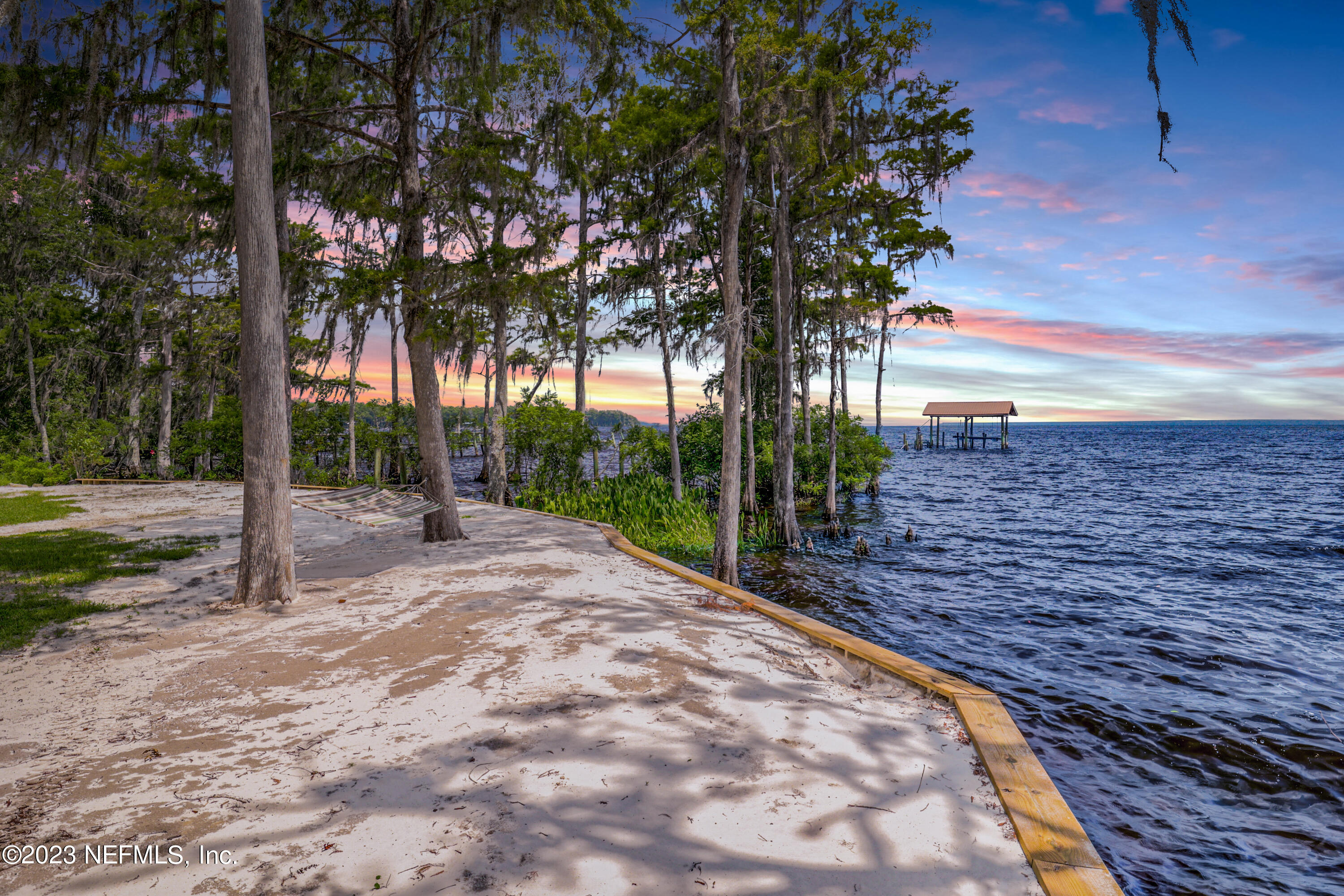 716 Cedar Creek Road Palatka, FL 32177 - Photo 52 of 62 a view of a backyard with large trees