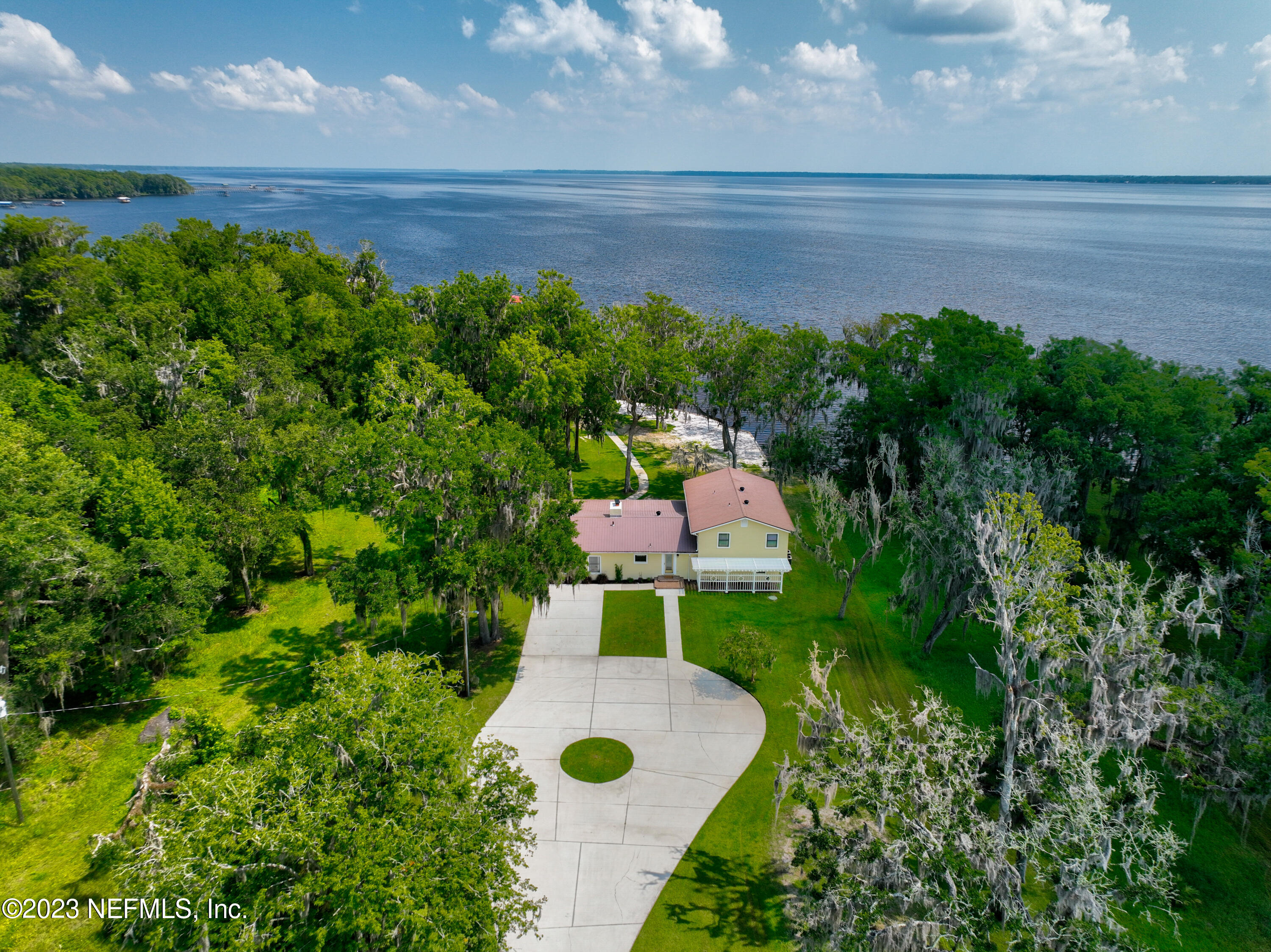 716 Cedar Creek Road Palatka, FL 32177 - Photo 9 of 62 a backyard of a house with lots of green space and garden