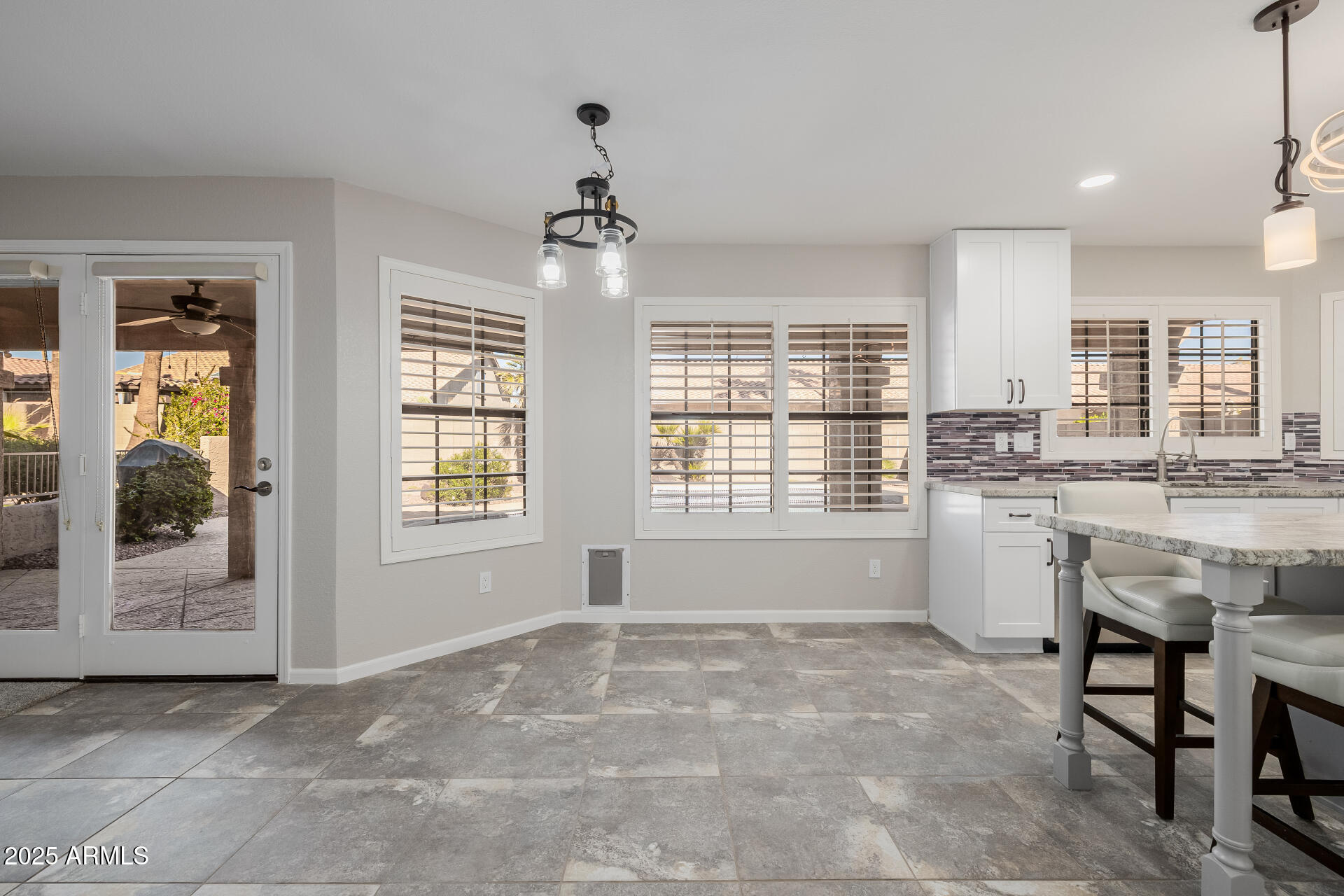 16809 South 33rd Way Phoenix, AZ 85048 - Photo 37 of 118 a view of an empty room with a kitchen