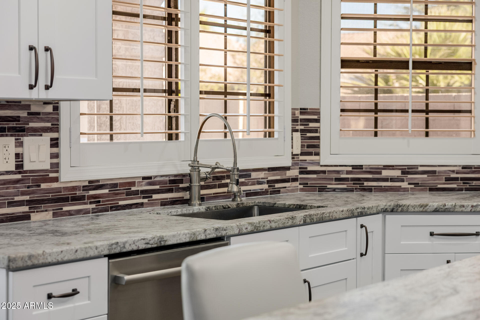 16809 South 33rd Way Phoenix, AZ 85048 - Photo 44 of 118 a kitchen with granite countertop a sink and a window