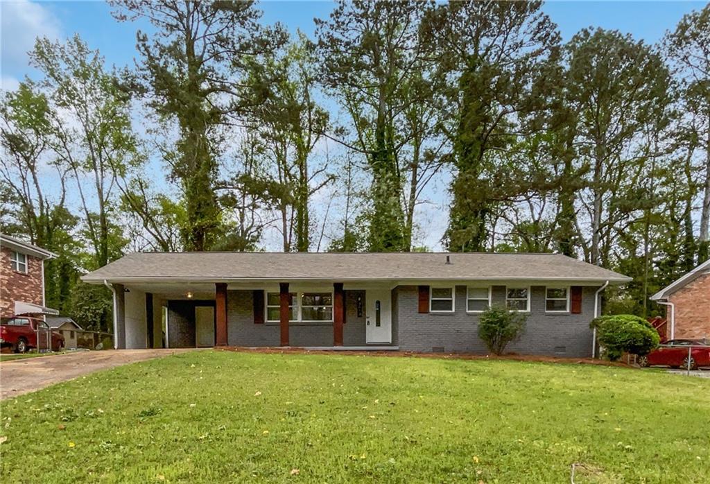 3653 Mecklinburg Place Decatur, GA 30032 - Photo 1 of 1 front view of a house with a garden