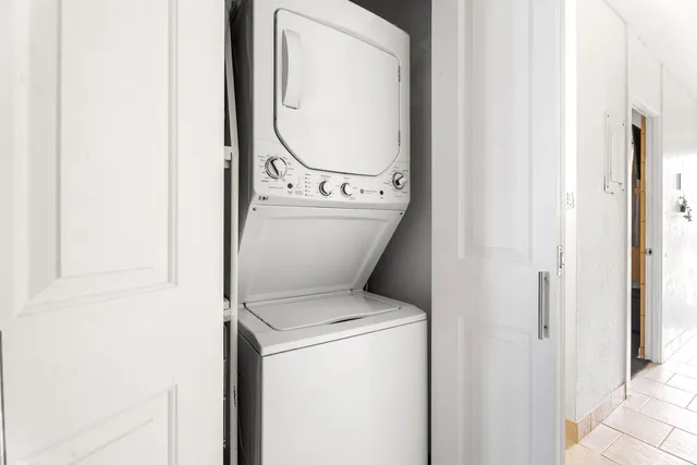 a view of bathroom with a washer and dryer