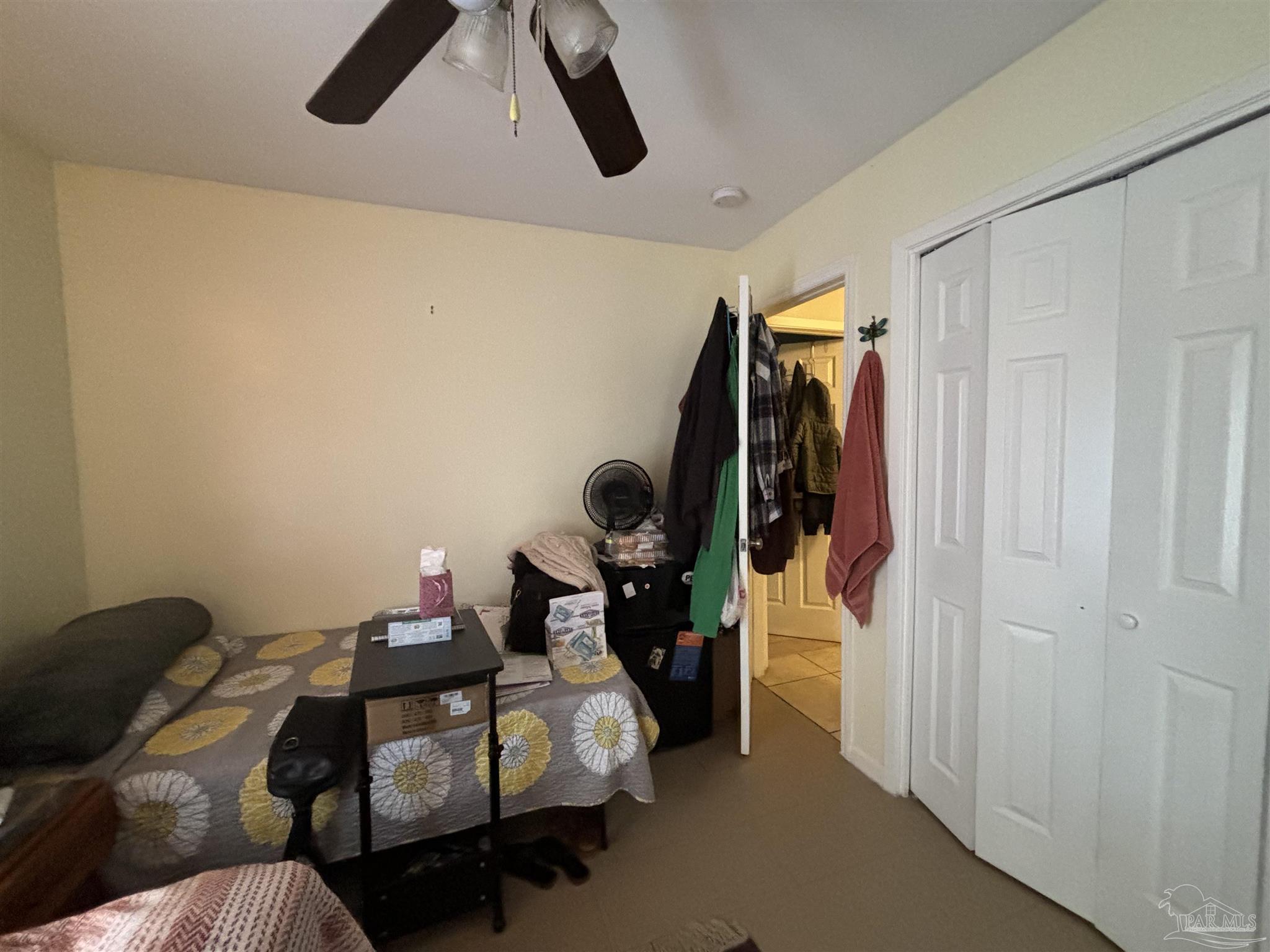 1080 Farmington Road Pensacola, FL 32504 - Photo 12 of 31 a bedroom with a bed and cabinets