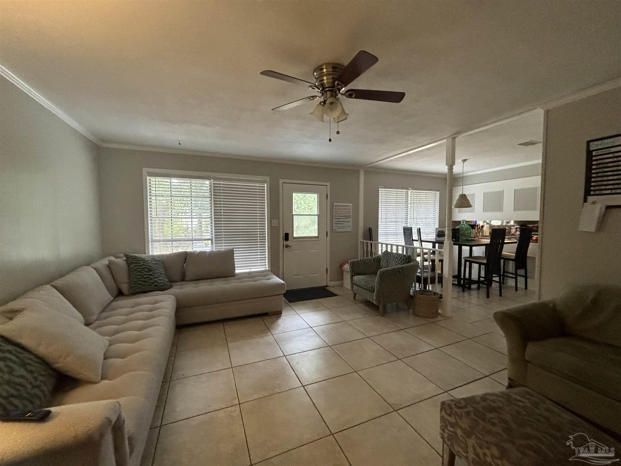 1080 Farmington Road Pensacola, FL 32504 - Photo 2 of 31 a living room with furniture and a window