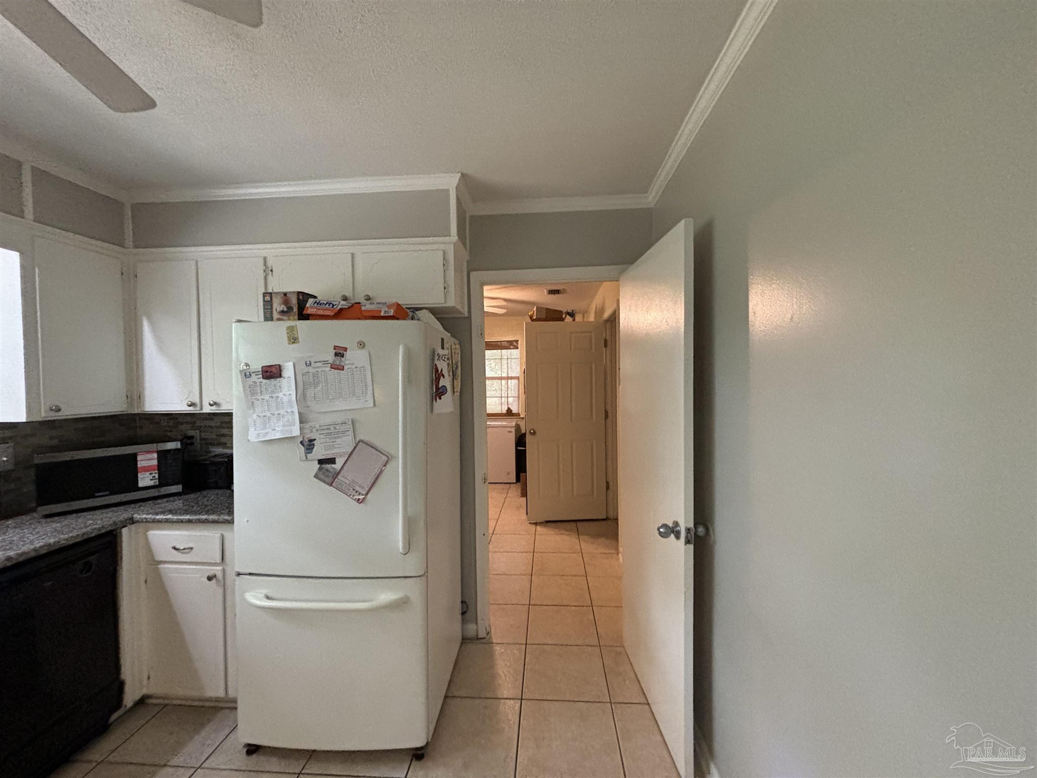 1080 Farmington Road Pensacola, FL 32504 - Photo 6 of 31 a white refrigerator freezer and a stove in a kitchen