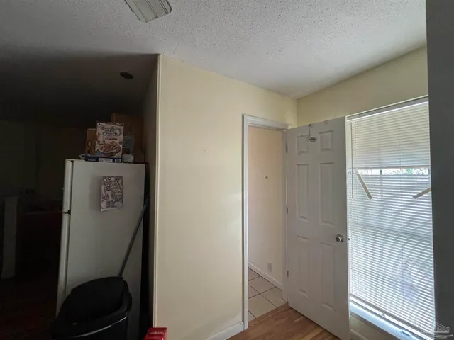 a bedroom with a bed and cabinets