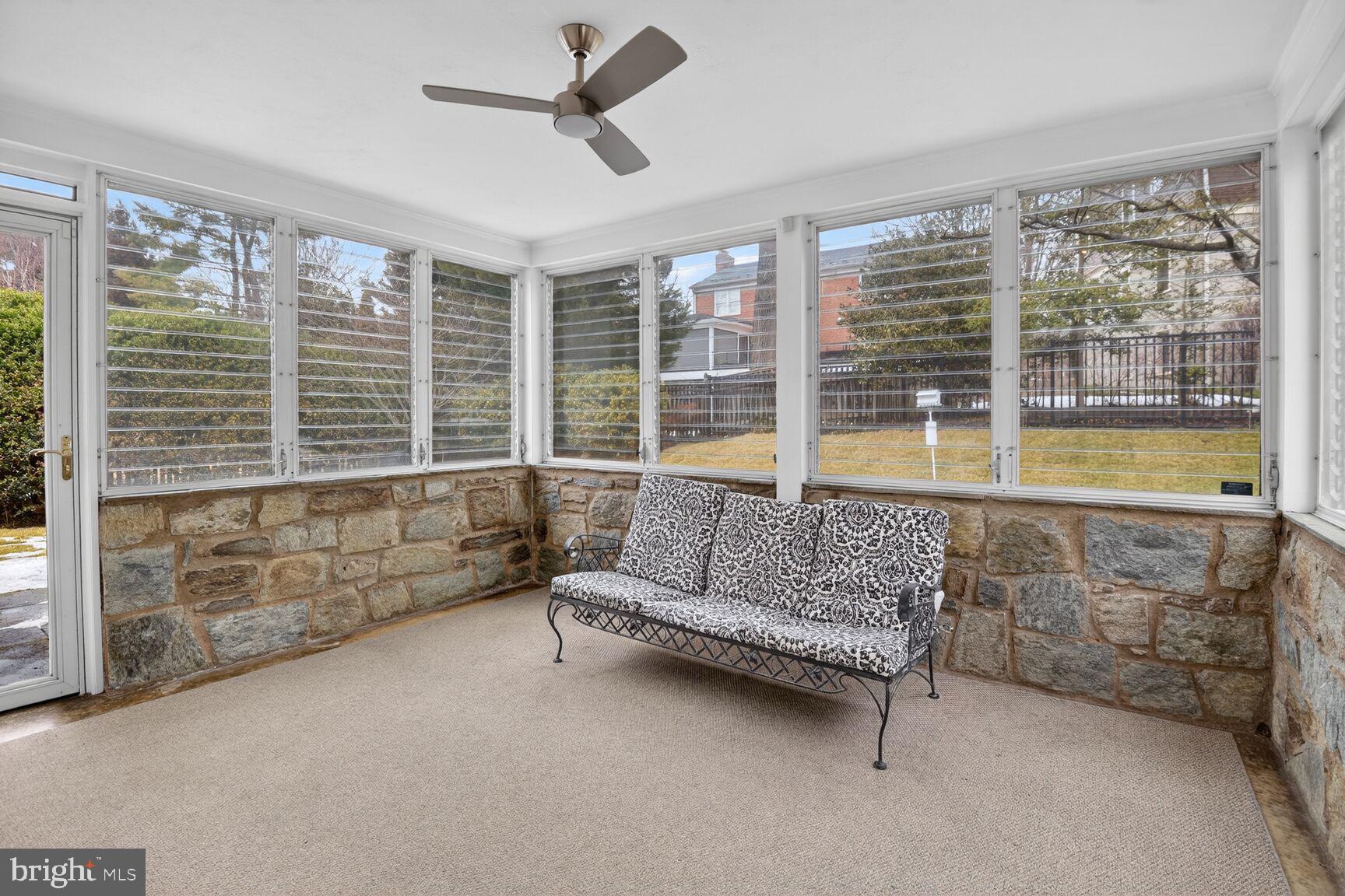 4709 River Road Bethesda, MD 20816 - Photo 14 of 25 a living room with furniture and a large window