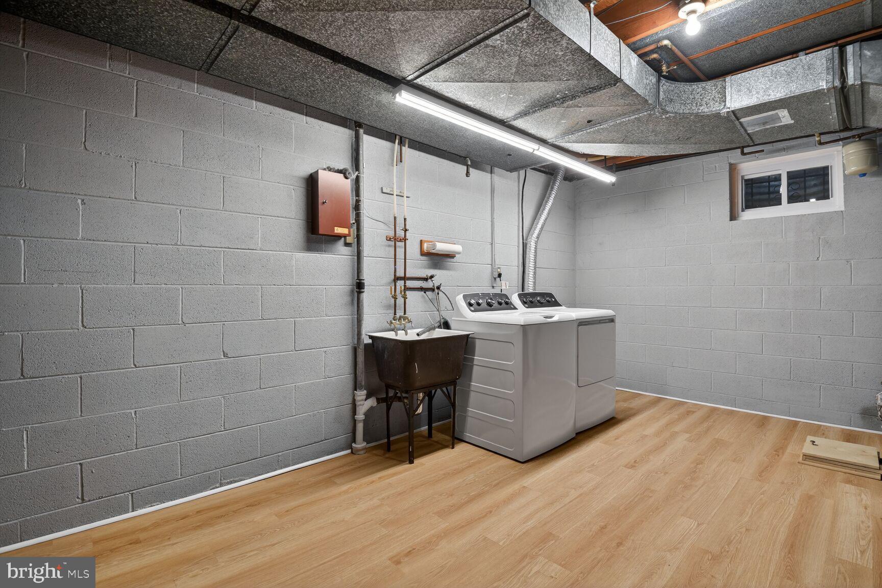 4709 River Road Bethesda, MD 20816 - Photo 20 of 25 a room with a wooden floor and utility room