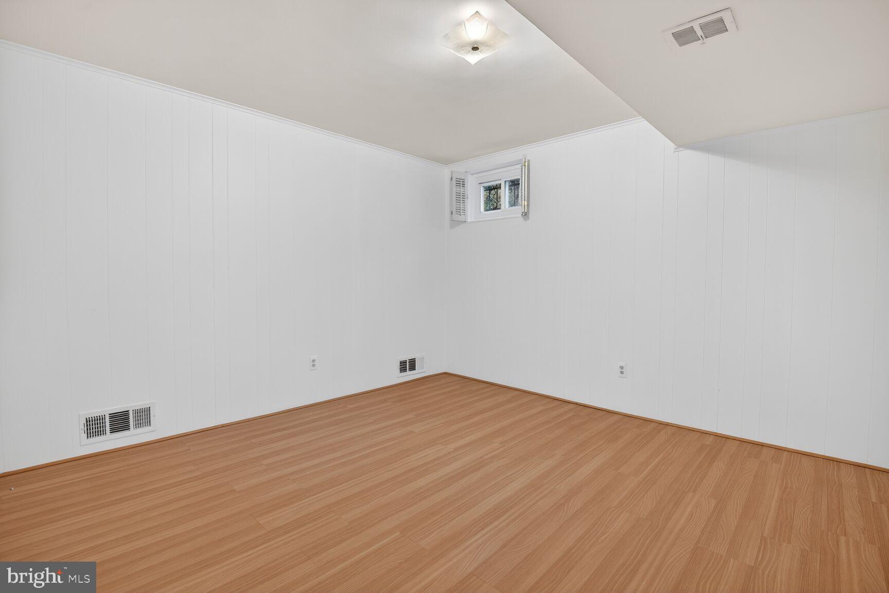 4709 River Road Bethesda, MD 20816 - Photo 23 of 25 a view of empty room with wooden floor