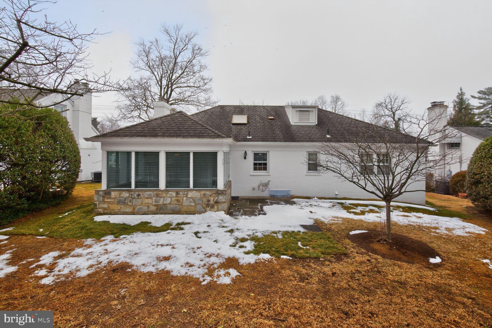 4709 River Road Bethesda, MD 20816 - Photo 3 of 25 a front view of a house with a yard