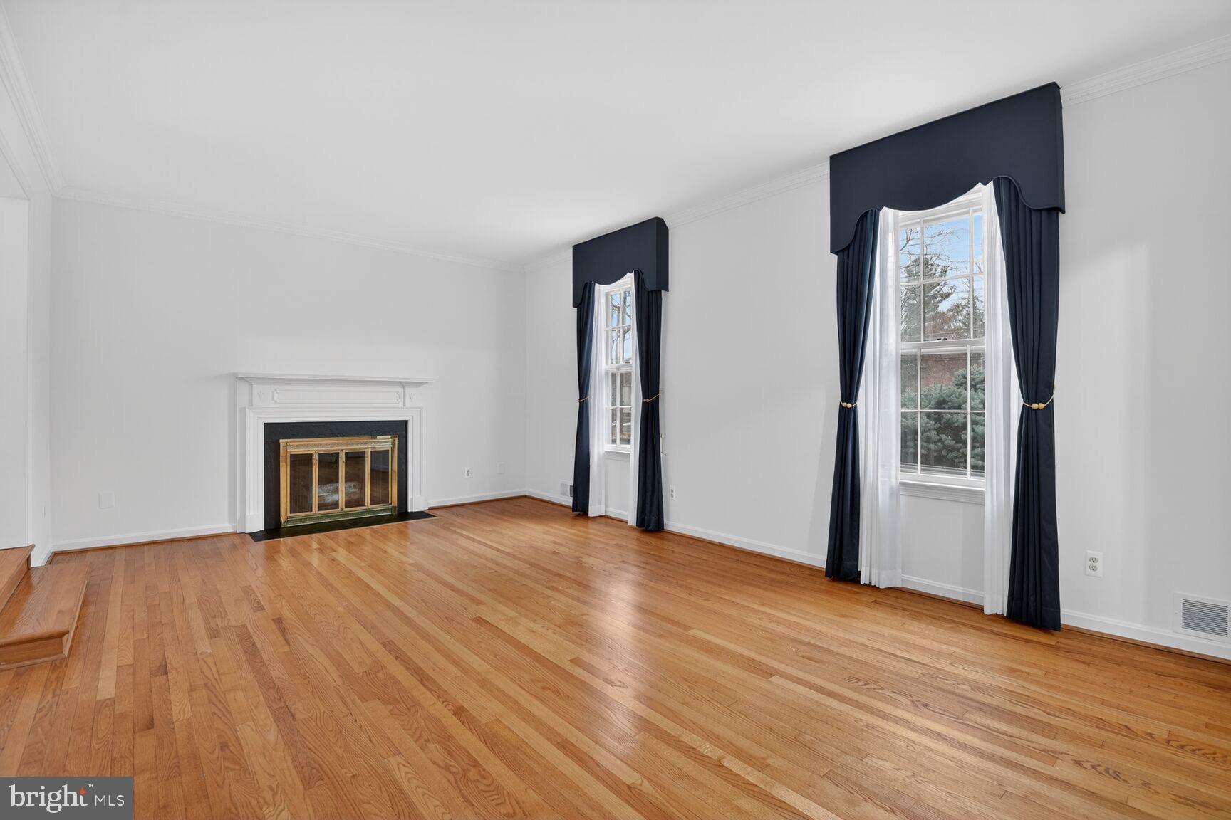 4709 River Road Bethesda, MD 20816 - Photo 7 of 25 a view of an empty room with wooden floor and a window