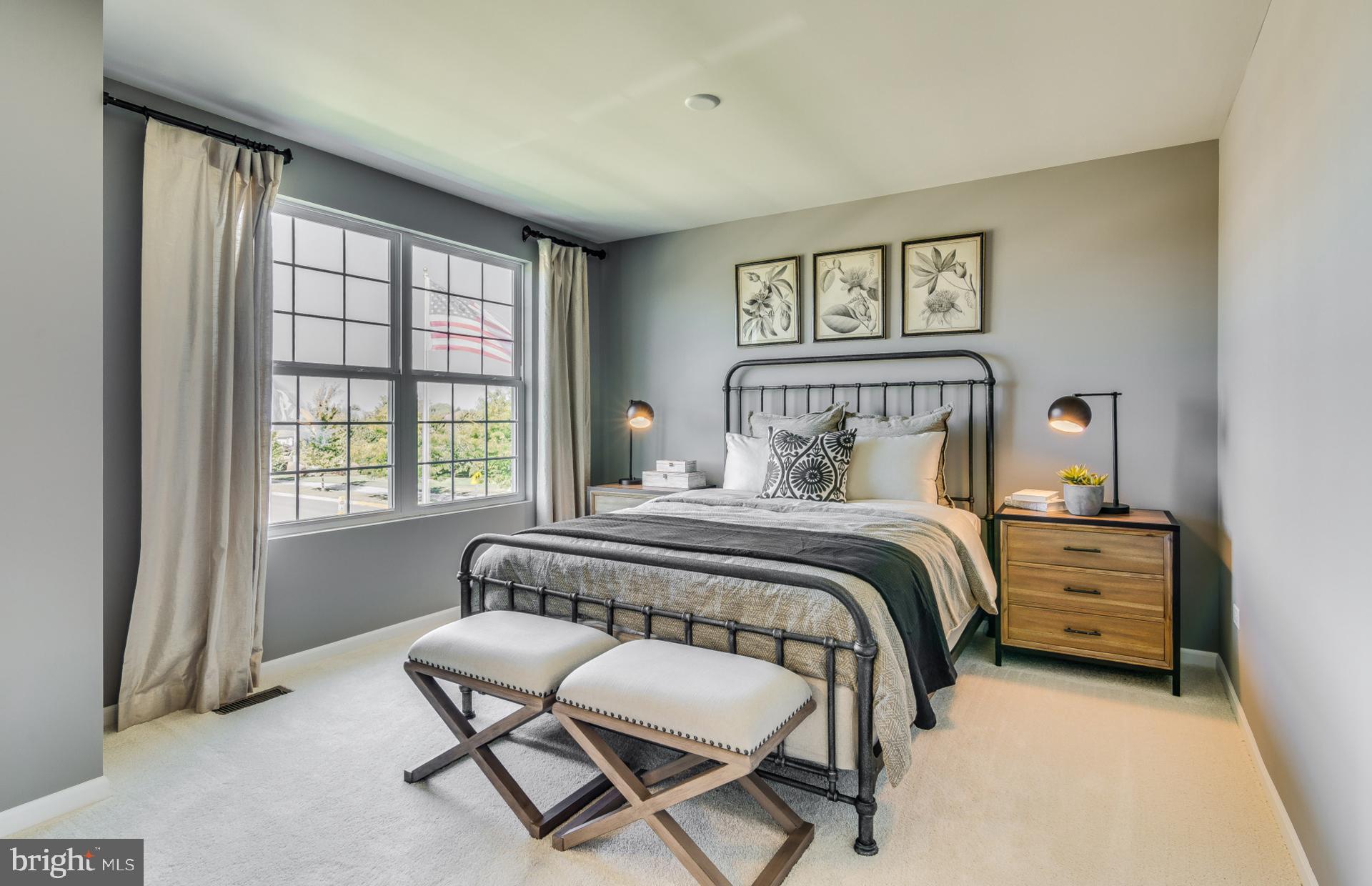 14528 Sourgum Road Boyds, MD 20841 - Photo 2 of 18 a bedroom with a bed and a large window