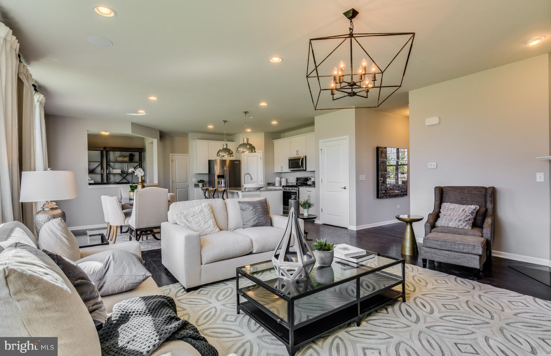 14528 Sourgum Road Boyds, MD 20841 - Photo 7 of 18 a living room with furniture and a chandelier
