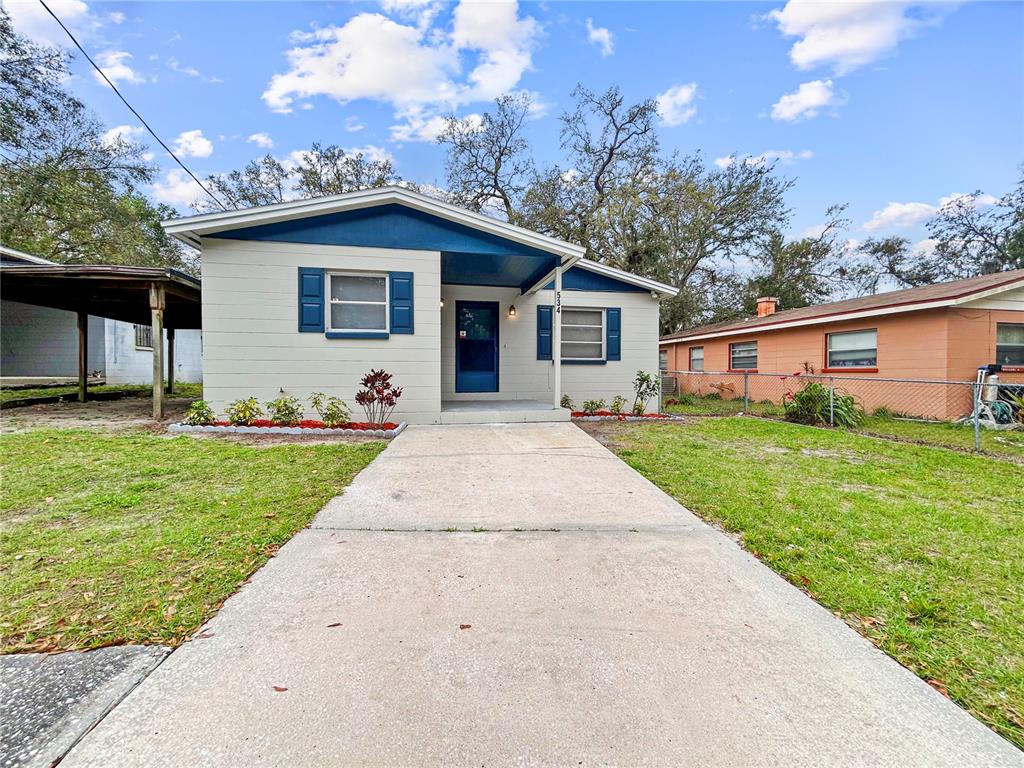 534 Mceachern Street Lakeland, FL 33805 - Photo 1 of 1 a front view of house with yard and green space