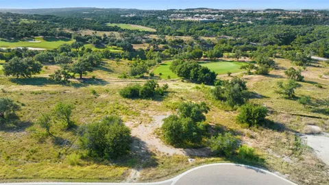 a view of park chair and trees