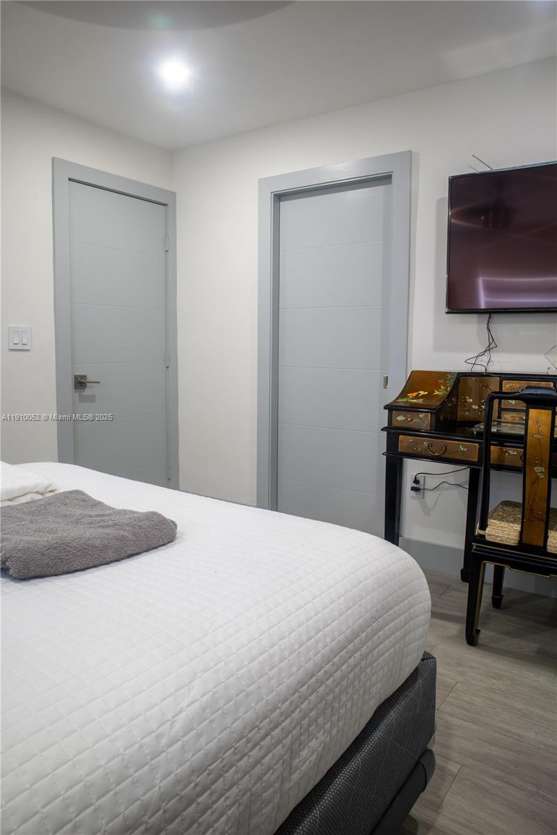 3541 Southwest 105th Court Miami, FL 33165 - Photo 13 of 22 a bedroom with a bed and flat screen tv