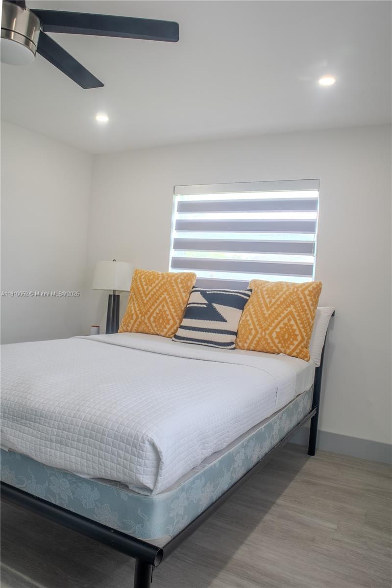 3541 Southwest 105th Court Miami, FL 33165 - Photo 17 of 22 a bedroom with a bed and painted walls