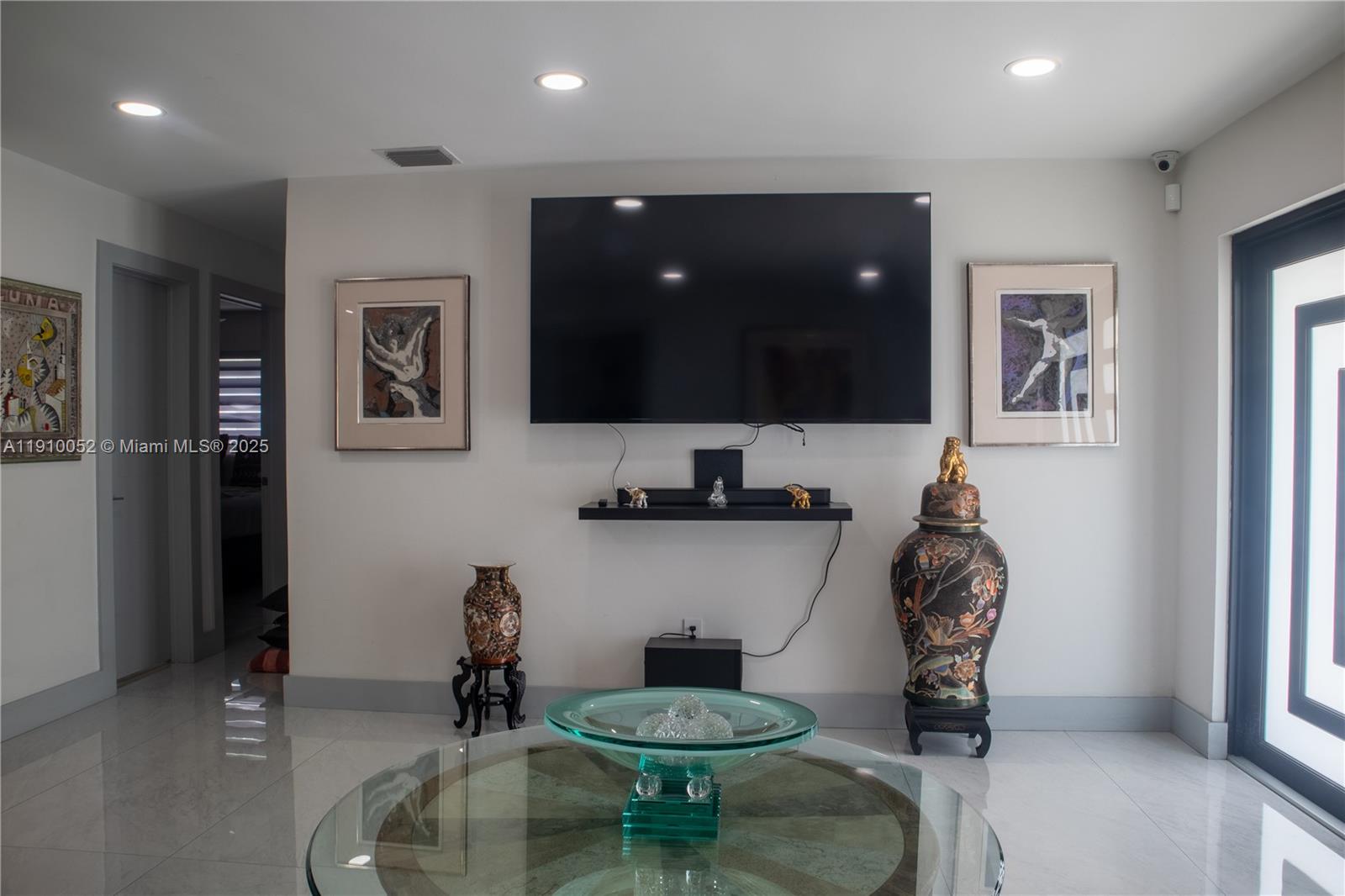 3541 Southwest 105th Court Miami, FL 33165 - Photo 2 of 22 a room with furniture and a flat screen tv