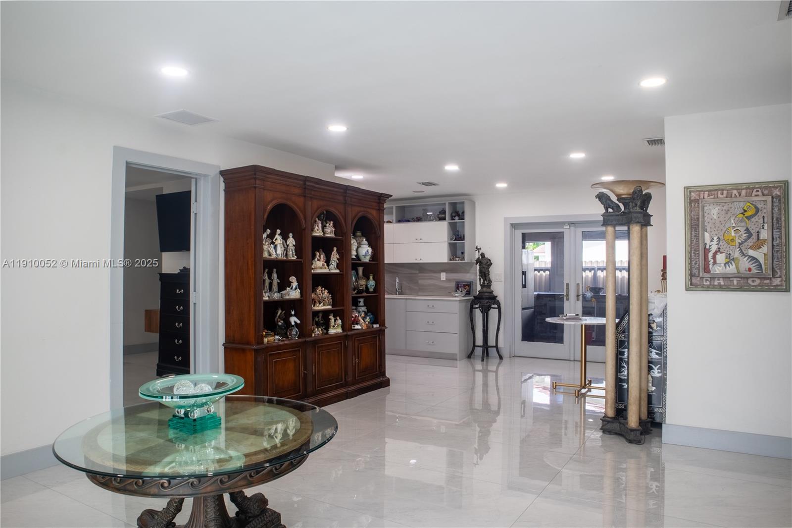 3541 Southwest 105th Court Miami, FL 33165 - Photo 3 of 22 a view of a living room and kitchen area