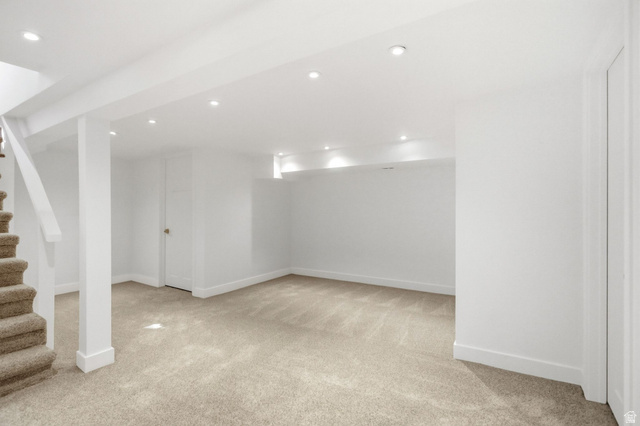 1187 East Ridgedale Circle Millcreek, UT 84106 - Photo 19 of 49 Spacious lower level featuring light-toned carpet flooring, recessed lighting, white walls, and white trim