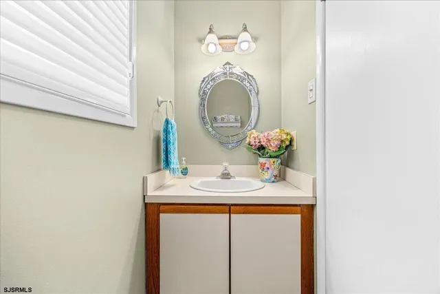 a bathroom with a sink and a mirror