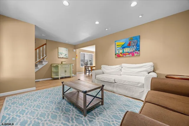 a living room with furniture and a rug