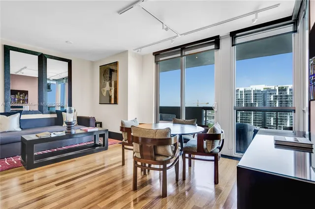 a view of a dining room with furniture window and wooden floor