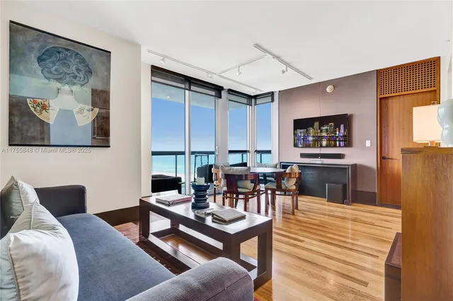 a living room with furniture and a table