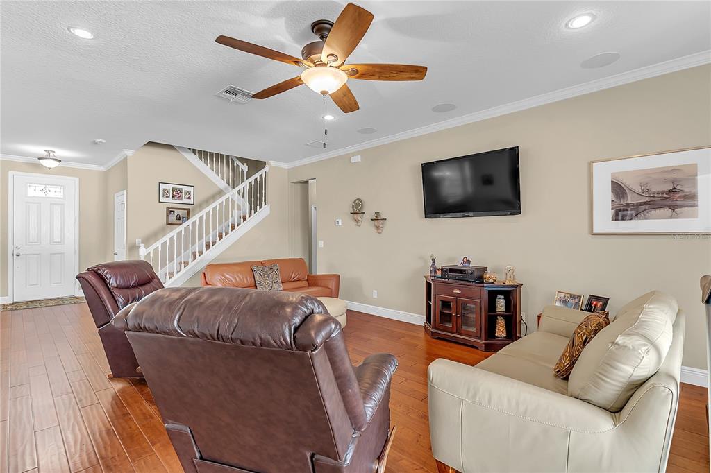 877 Strathmore Drive Orlando, FL 32803 - Photo 13 of 38 a living room with furniture and a flat screen tv