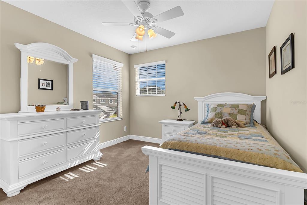 877 Strathmore Drive Orlando, FL 32803 - Photo 27 of 38 a bathroom with a granite countertop sink mirror and vanity