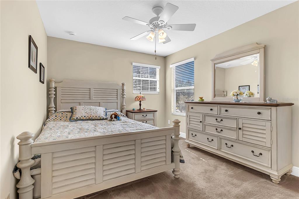 877 Strathmore Drive Orlando, FL 32803 - Photo 29 of 38 a bedroom with a bed and a dresser