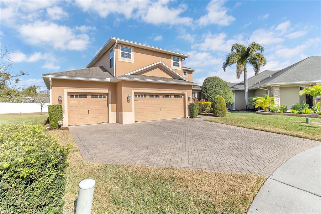 877 Strathmore Drive Orlando, FL 32803 - Photo 31 of 38 a front view of a house with a garden