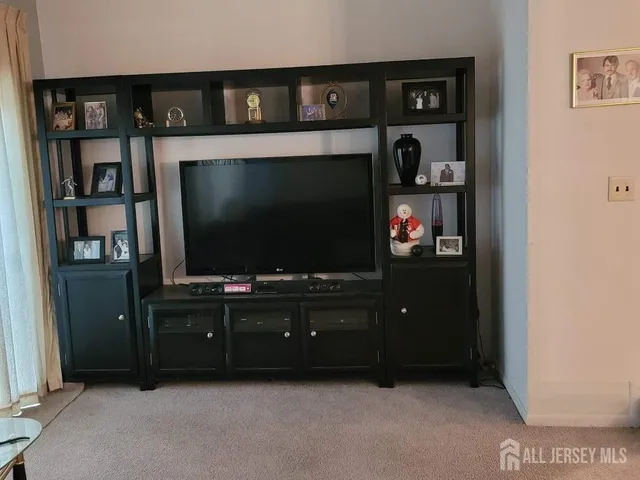 a living room with flat screen tv