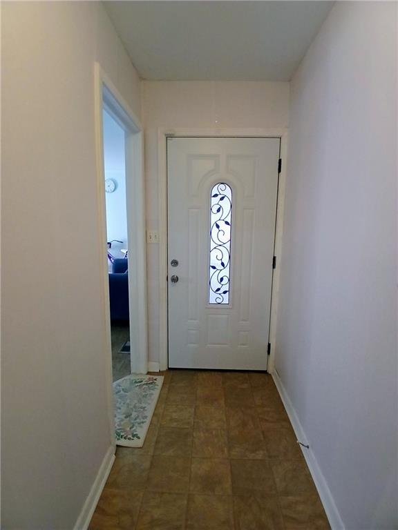 242 Lake Jodeco Road, Unit 242 Jonesboro, GA 30236 - Photo 11 of 45 an empty room with windows