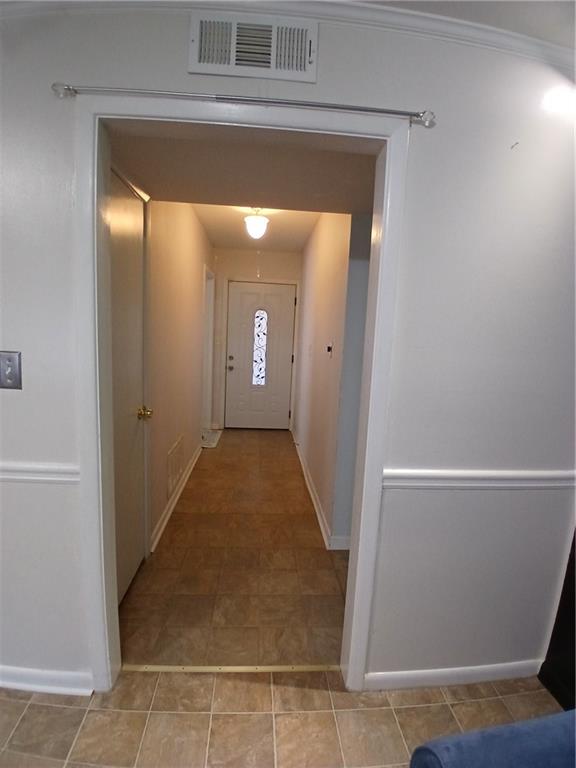242 Lake Jodeco Road, Unit 242 Jonesboro, GA 30236 - Photo 12 of 45 a view of a hallway with wooden floor and a living room