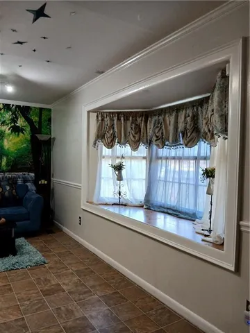 a kitchen with granite countertop a refrigerator and a stove