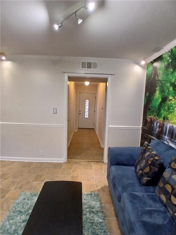 242 Lake Jodeco Road, Unit 242 Jonesboro, GA 30236 - Photo 15 of 45 a living room with furniture and a large window
