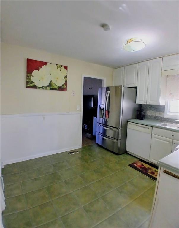 242 Lake Jodeco Road, Unit 242 Jonesboro, GA 30236 - Photo 21 of 45 a kitchen with stainless steel appliances granite countertop a refrigerator and a sink