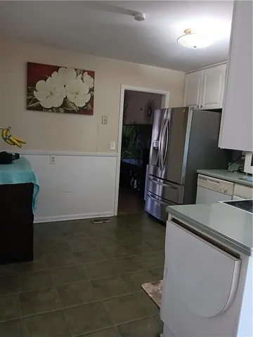 a bathroom with a sink toilet and a mirror