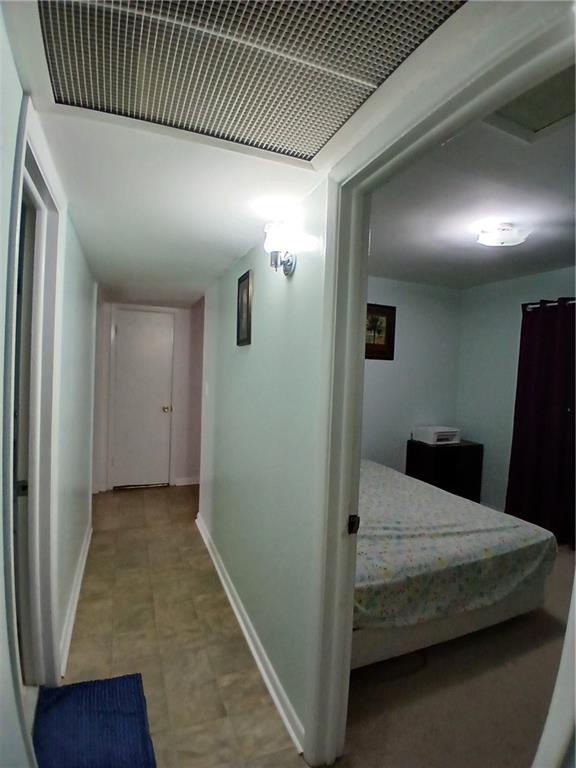 242 Lake Jodeco Road, Unit 242 Jonesboro, GA 30236 - Photo 30 of 45 a bedroom with a bed and a walk in closet