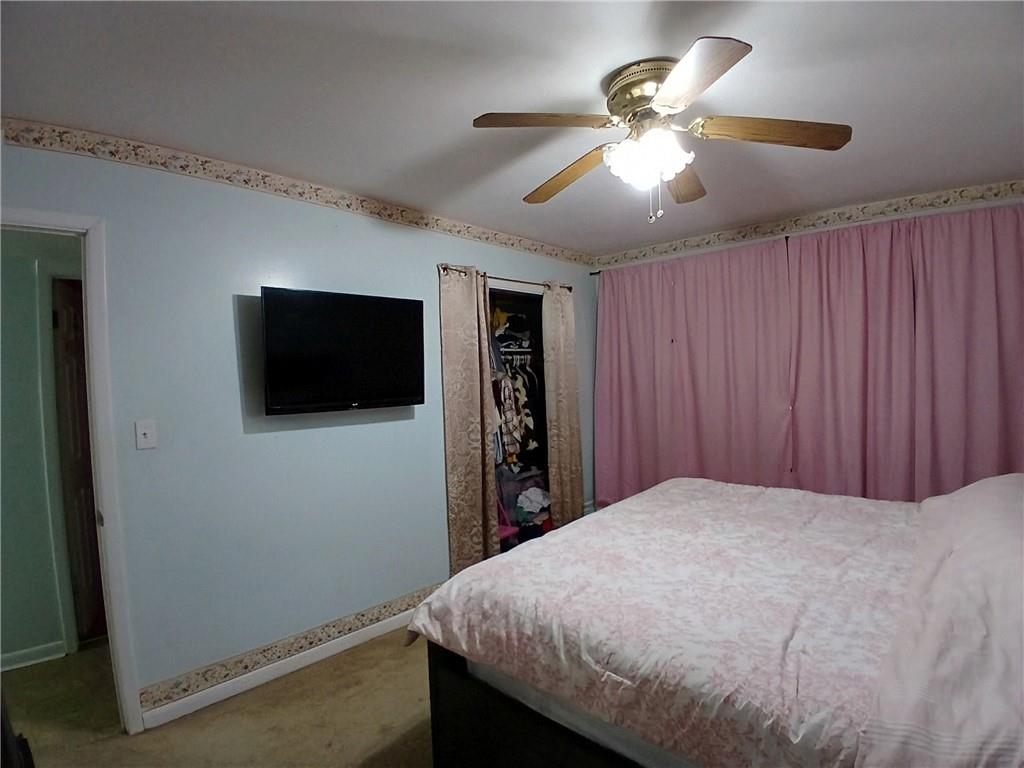 242 Lake Jodeco Road, Unit 242 Jonesboro, GA 30236 - Photo 37 of 45 a bed room with a bed and a television