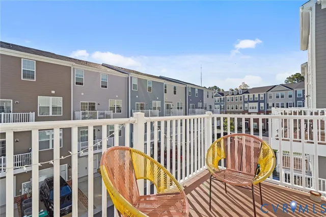 a view of a balcony with wooden floor