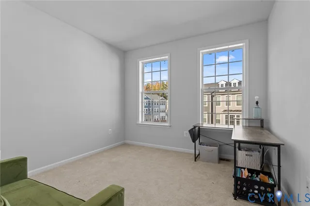 a workspace with furniture and a window