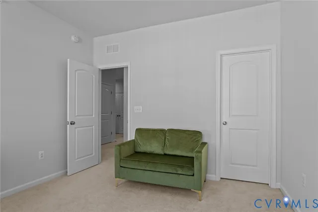 a bathroom with a granite countertop sink a toilet and a mirror
